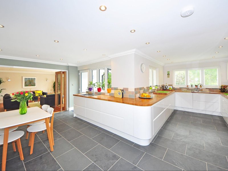 Grey tile floors in an open concept kitchen